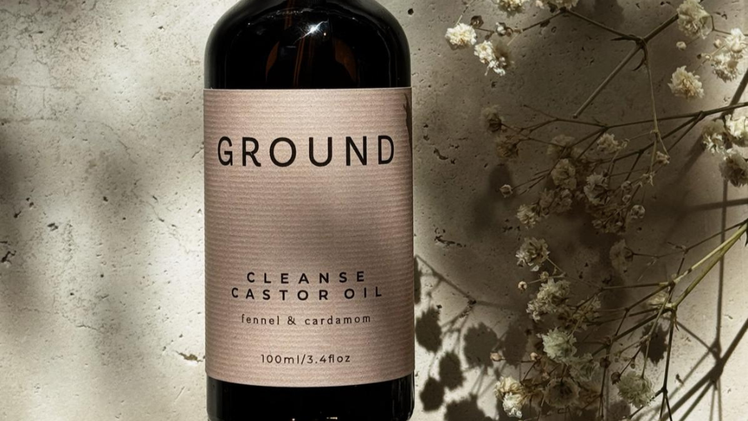 Close up photograph of Ground Cleanse Castor Oil with fennel and cardomom 3.4 fl oz.