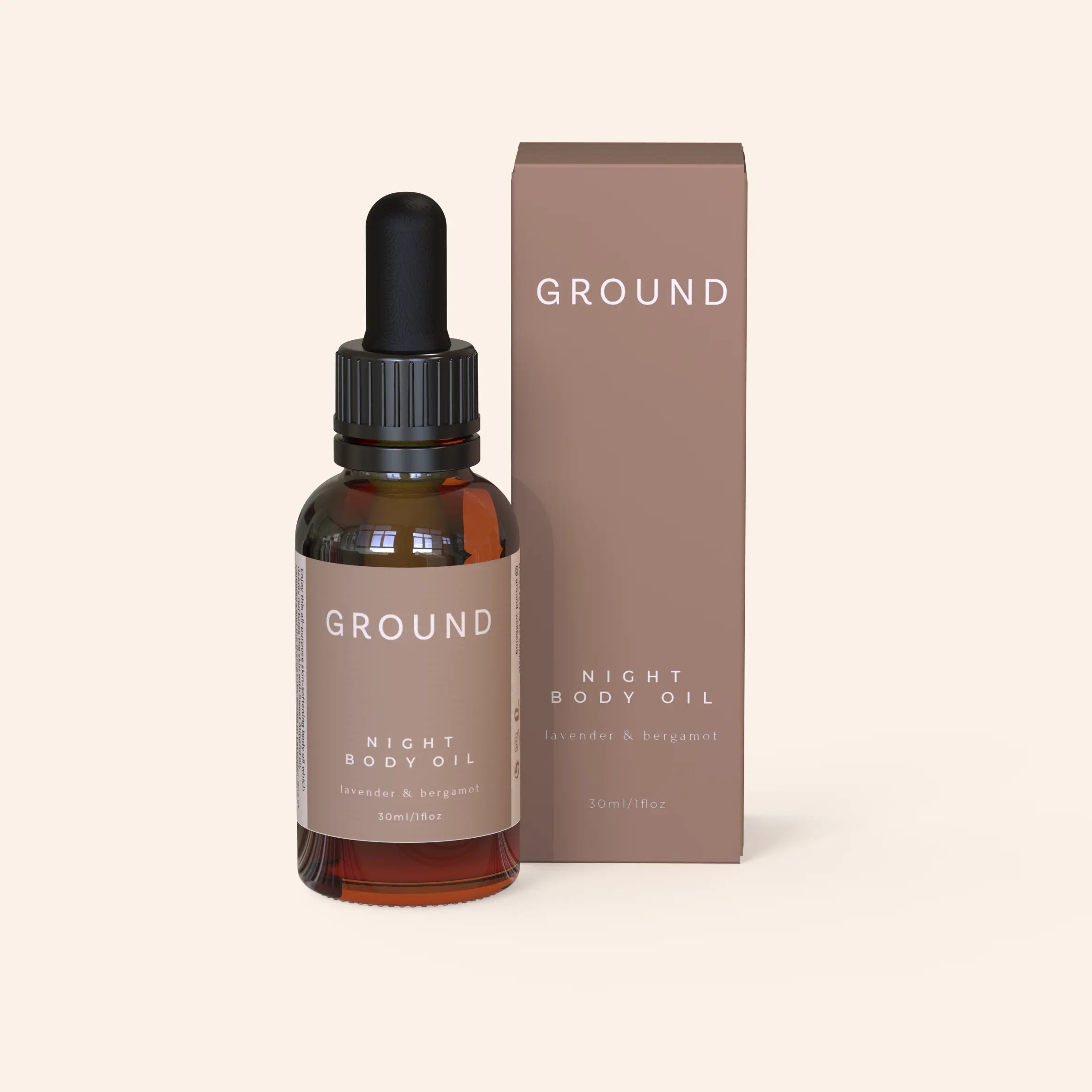 Ground Night Body Oil containing lavender and bergamot standing beside its packaging. The colour theme of this product is a neutral brown.