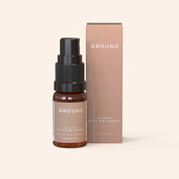 A bottle of 'Sleep Pillow Spray' by Ground Wellbeing, next to its packaging box, with the brand's logo 'GROUND'.
