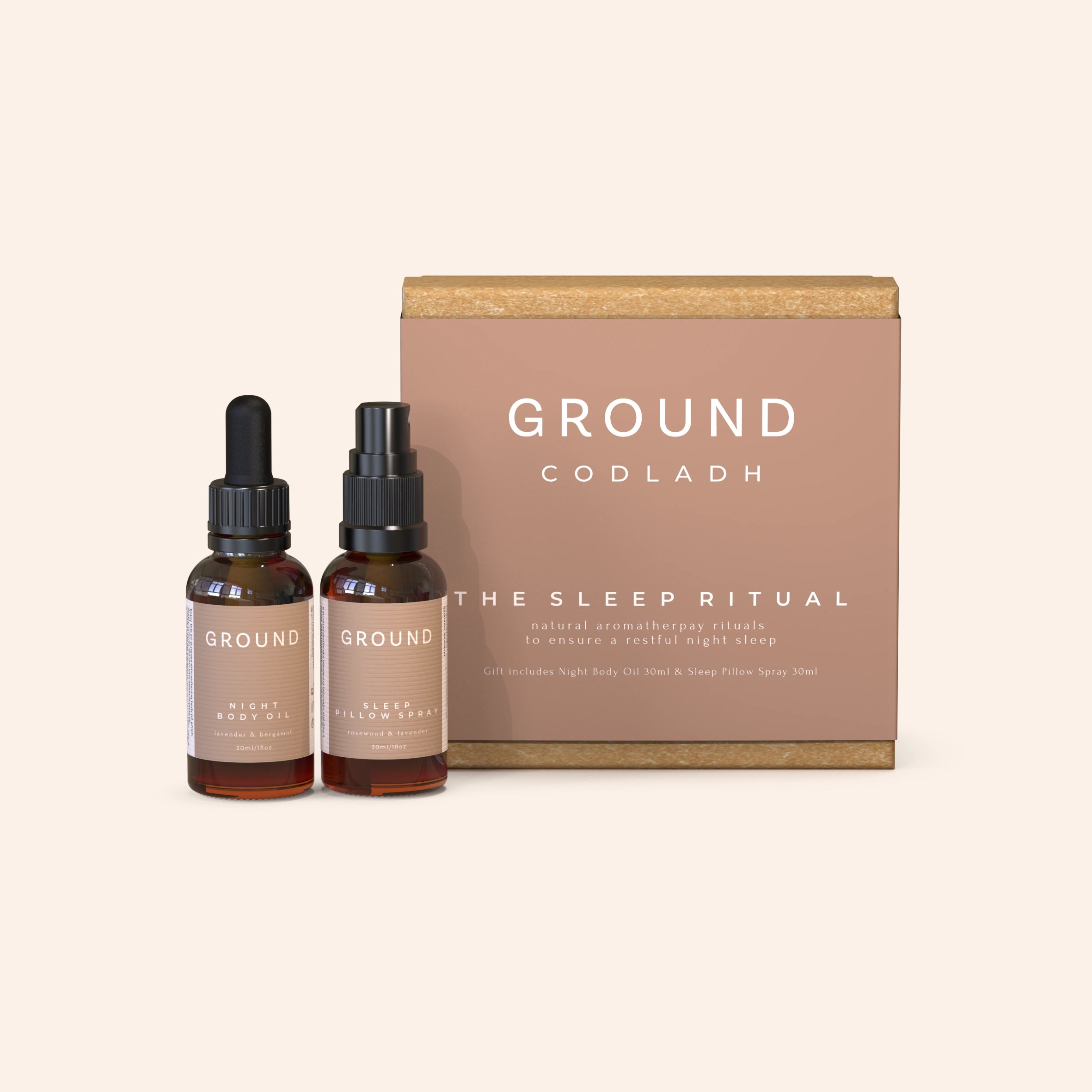 A gift box labelled 'Ground Códlaidh - THE SLEEP RITUAL' containing two bottles, one with a dropper and the other with a spray nozzle, both labelled 'Night Body Oil' and 'Sleep Pillow Spray'.