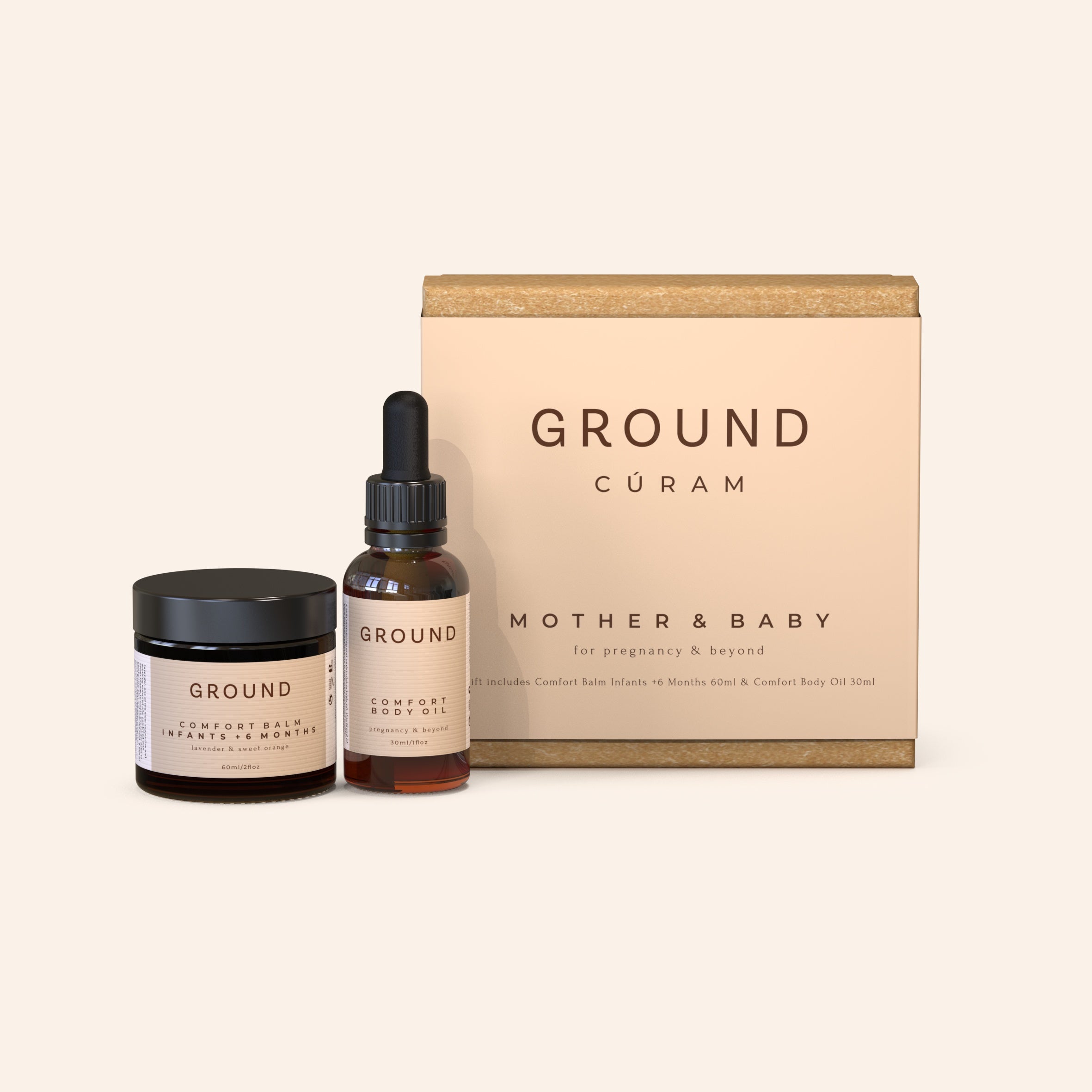 A gift box labelled 'GROUND CURAM MOTHER & BABY' with two skincare products in front, one in a black container and another in a brown glass dropper bottle.