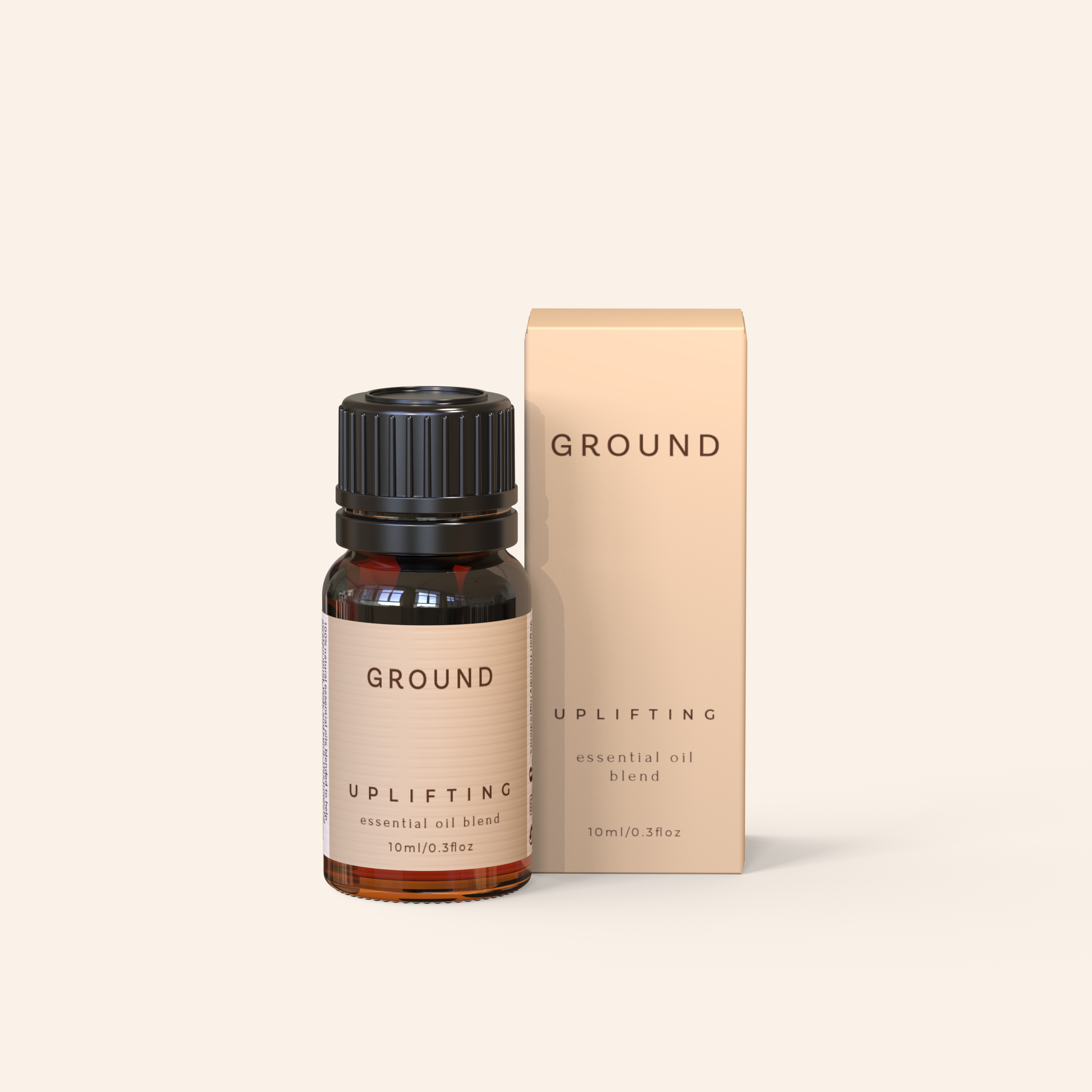 Image shows a small brown glass bottle of essential oil with a cream label stating 'GROUND' uplifting essential oil blend 10ml, 0.3 fl oz. It's packaging with 'GROUND' branding on a light beige background is sitting beside the bottle. Both are on a white background.