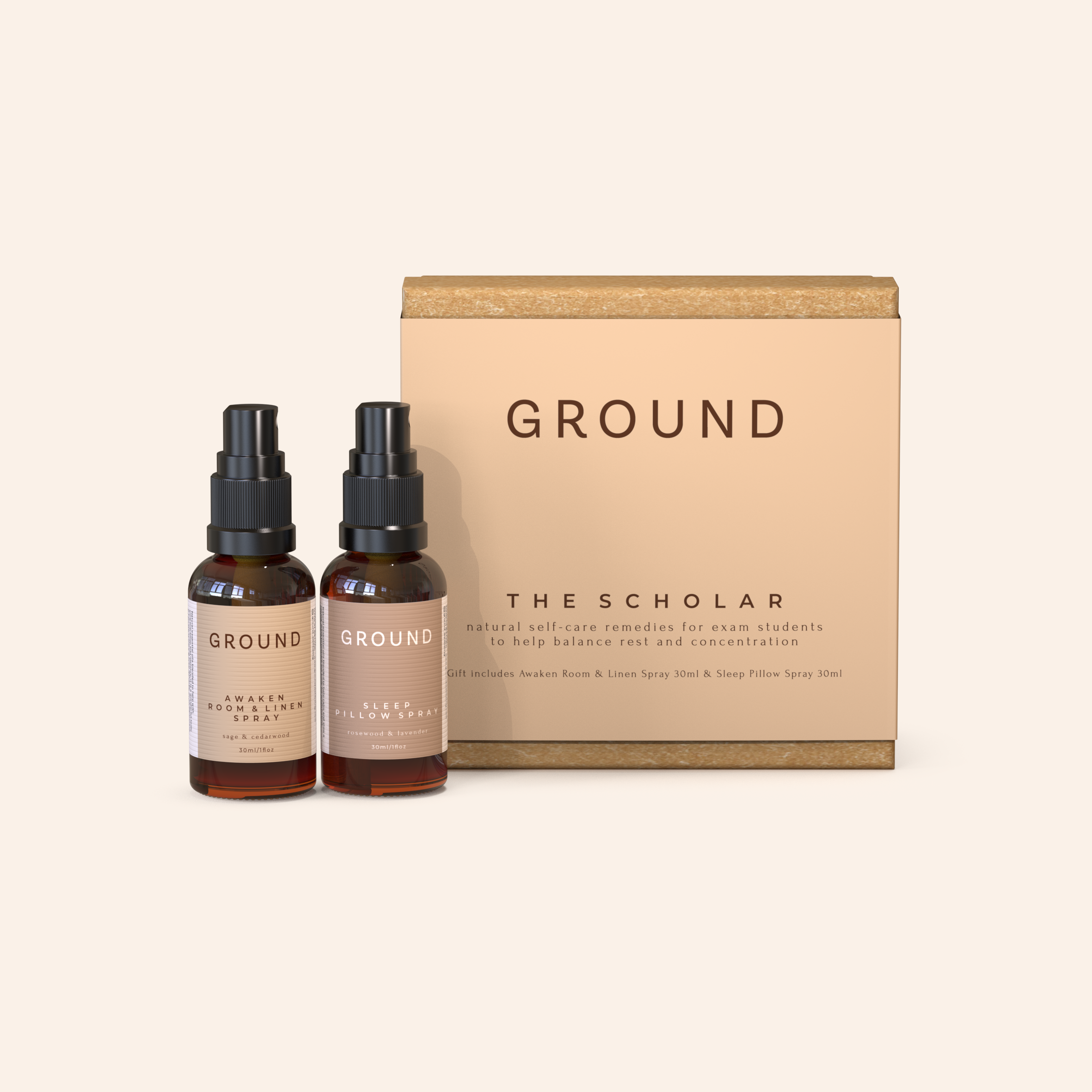 The image shows a medium-sized beige gift box labeled 'GROUND THE SCHOLAR' with two brown spray bottles in front, possibly containing the 'Codladh Sleep Pillow Spray' and 'Beo Focus Room & Clothing Spray' as mentioned in the product description.