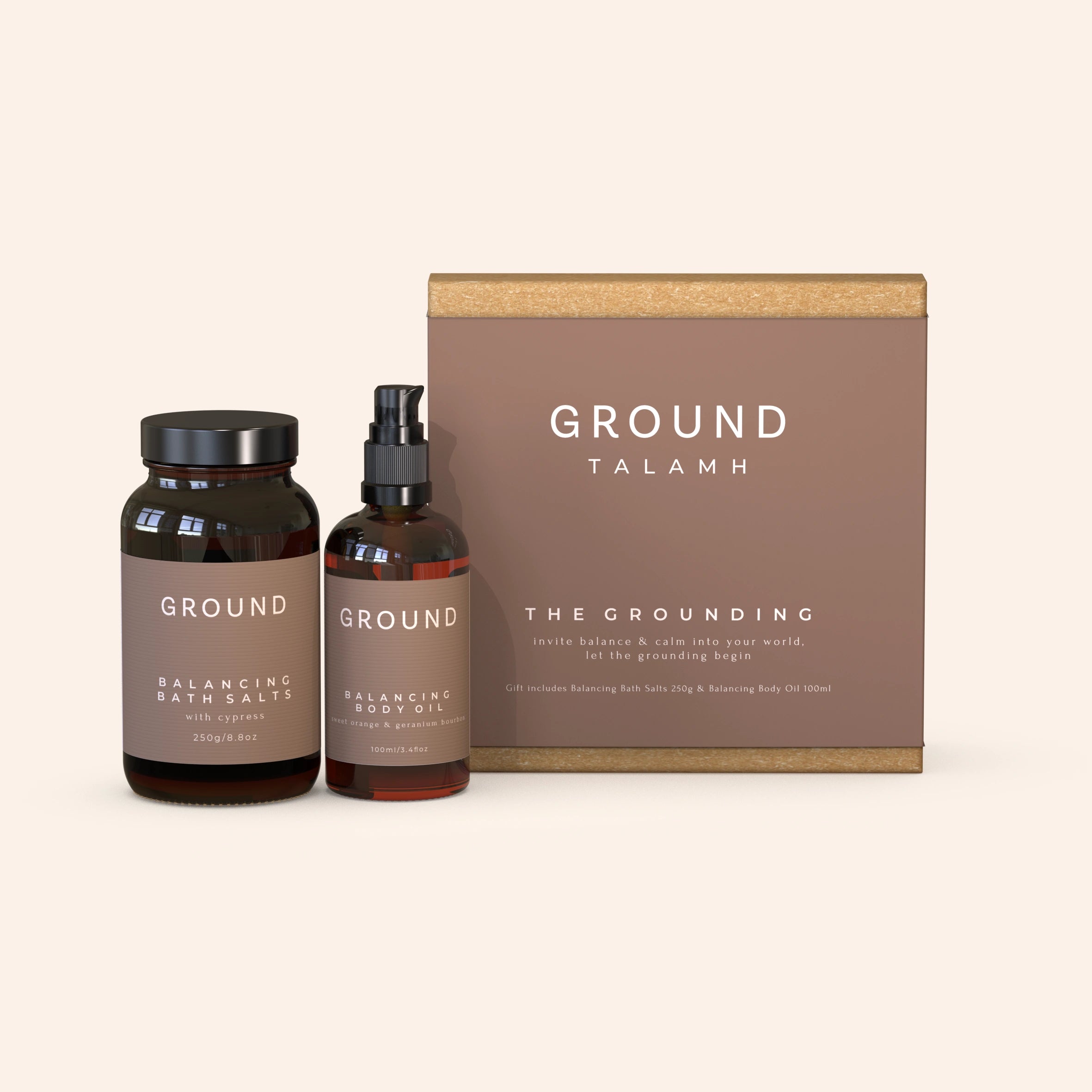 A large gift box labelled 'GROUND TALAMH' with two products in front of it. One is a jar labelled 'Balancing Bath Salts' and the other is a spray bottle labelled 'Balancing Body Oil'.